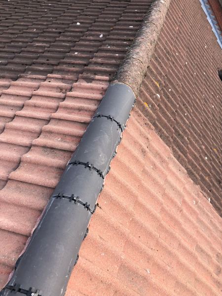New charcoal dry ridge with black clips meeting the older ridge beyond