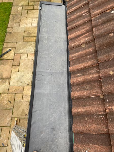Rubber membrane laid along the bay, tiles to one side