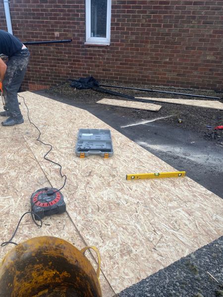 New OSB deck boards being laid across the roof
