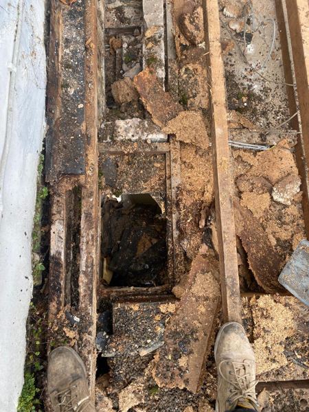 Old deck rotted and breaking up between the joists