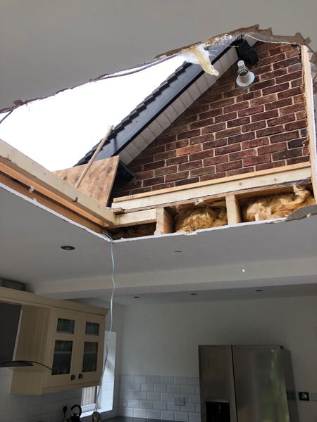 View up from the kitchen through the opened ceiling to the sky
