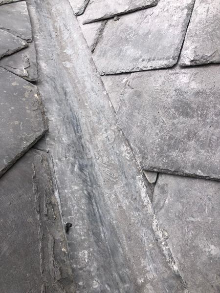 Close-up of the new lead channel between the cut slates