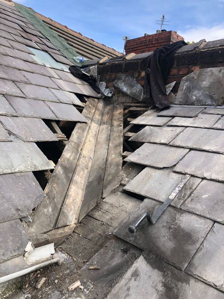 Valley opened up with slates stacked at the top against the brickwork